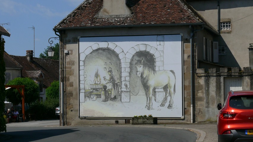 Wandmalerei an einem Dorfeingang